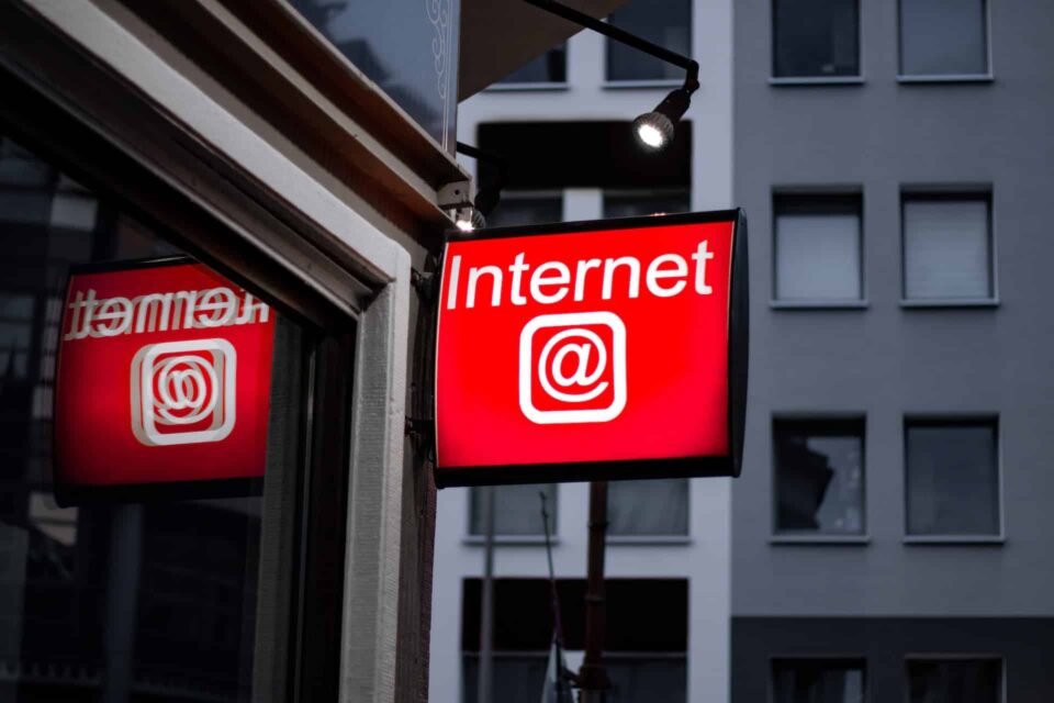 A screen showing the Internet in a red background with the "@" symbol